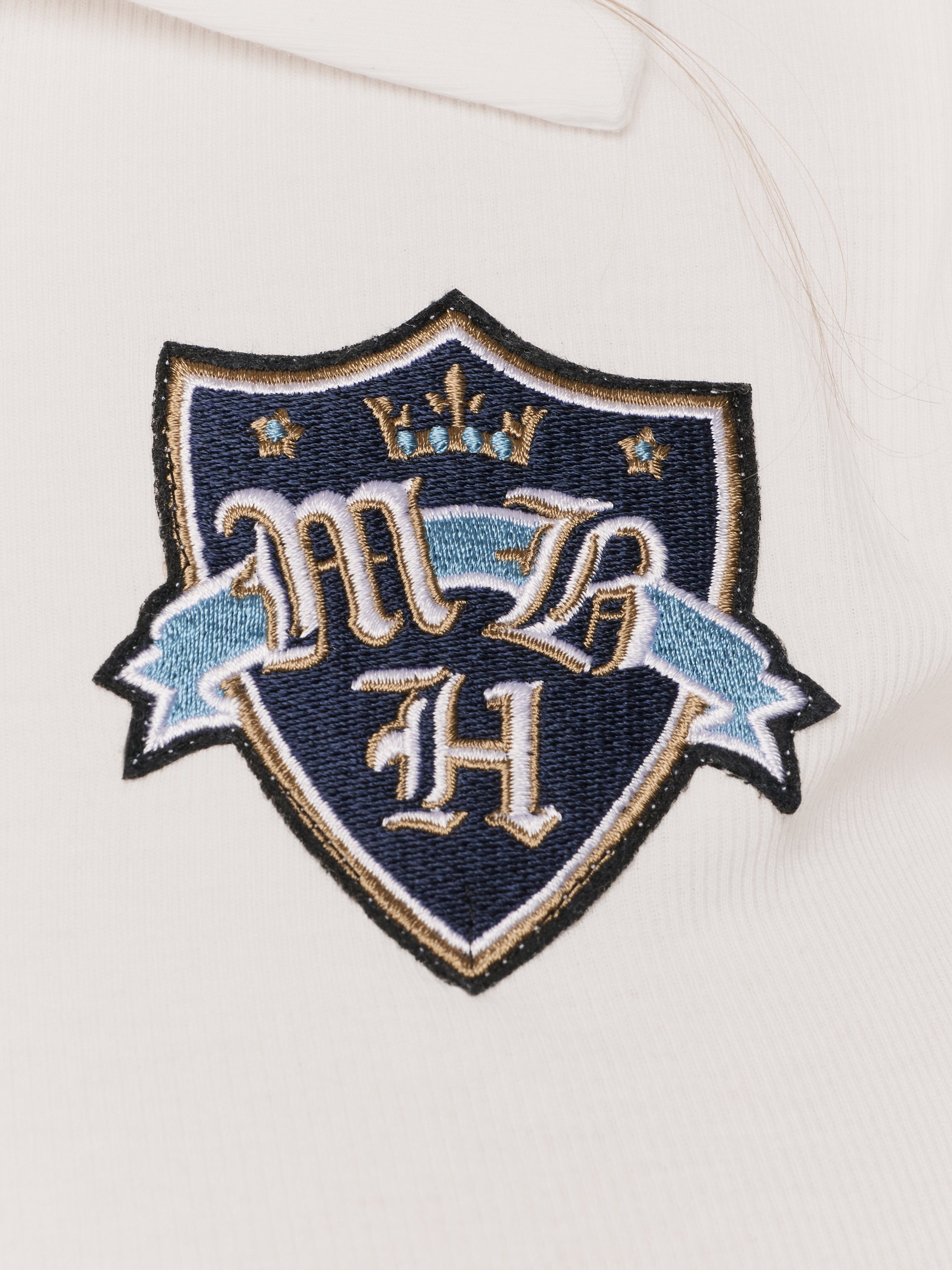 Crest Polo Top